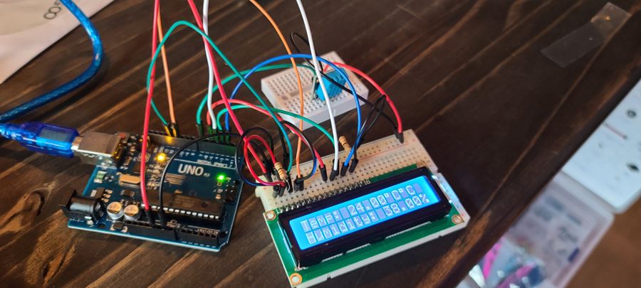 An Arduino board wired to a humidity and temperature sensor